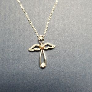 White gold angel necklace with diamond accents.